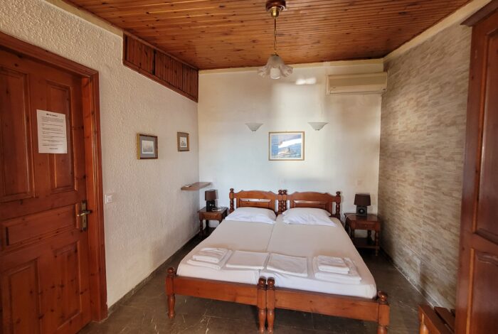 Comfortable twin bedroom in apartment section of Building C