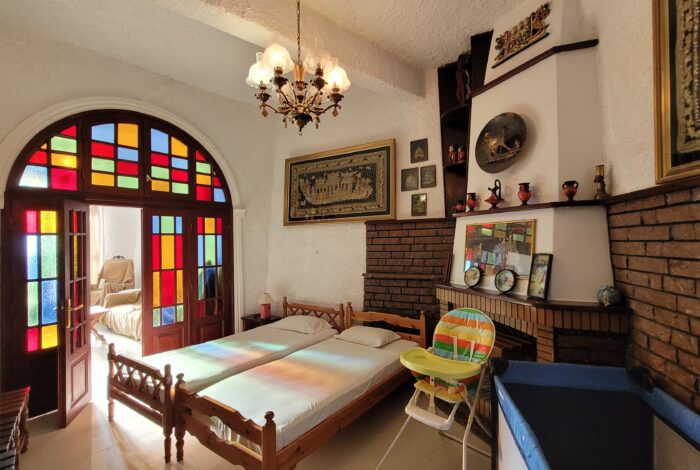 Living room with fireplace and sofa beds in Building B