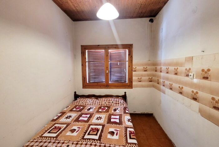 Guest bedroom in traditional Corfiot home with countryside views