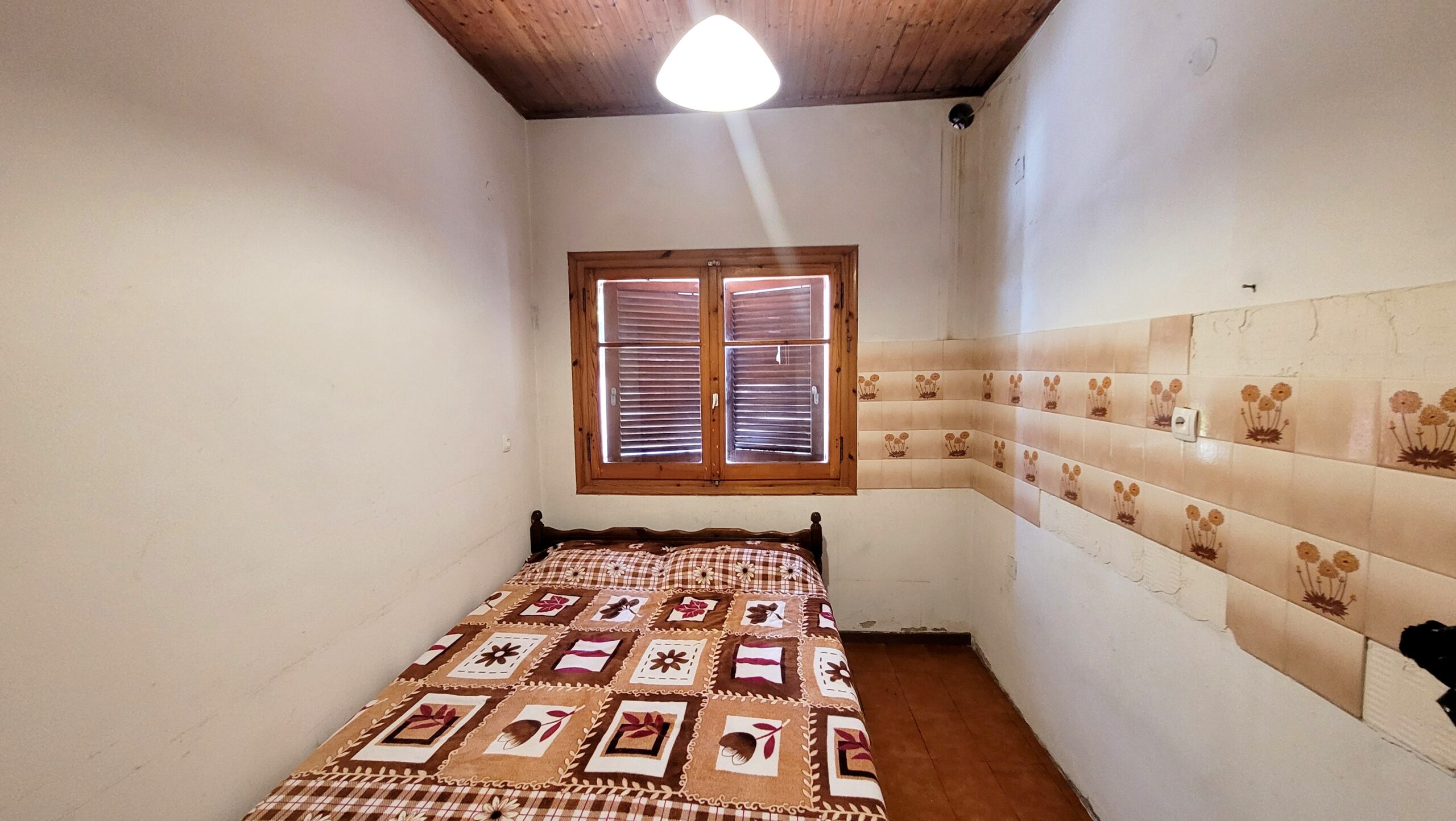 Guest bedroom in traditional Corfiot home with countryside views