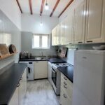 Bright kitchen area inside central Corfu house
