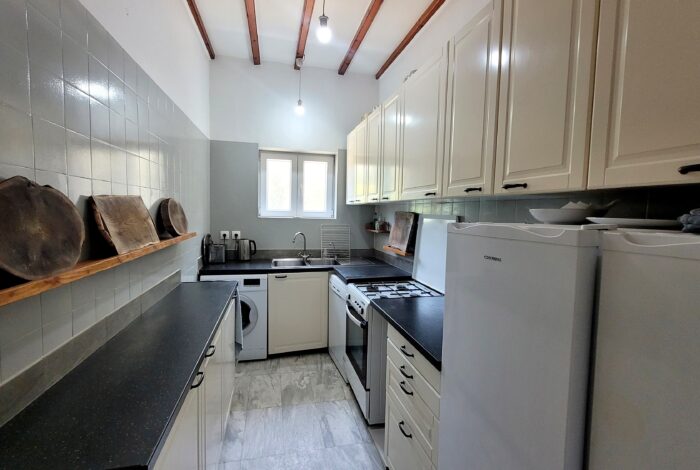 Bright kitchen area inside central Corfu house