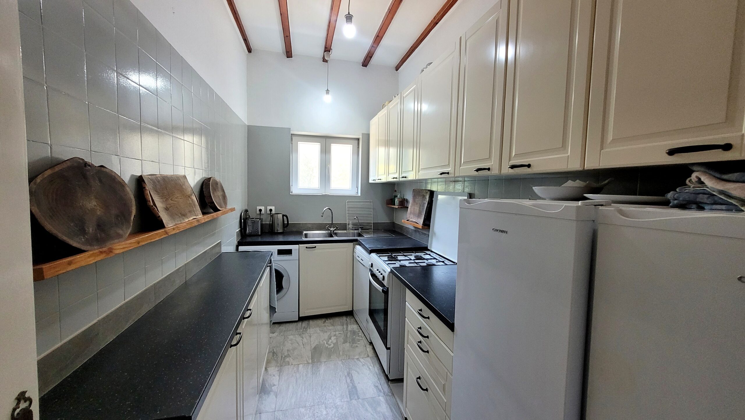 Bright kitchen area inside central Corfu house