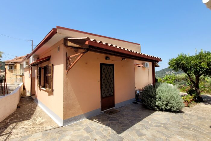 Entrance to detached house with paved outdoor space