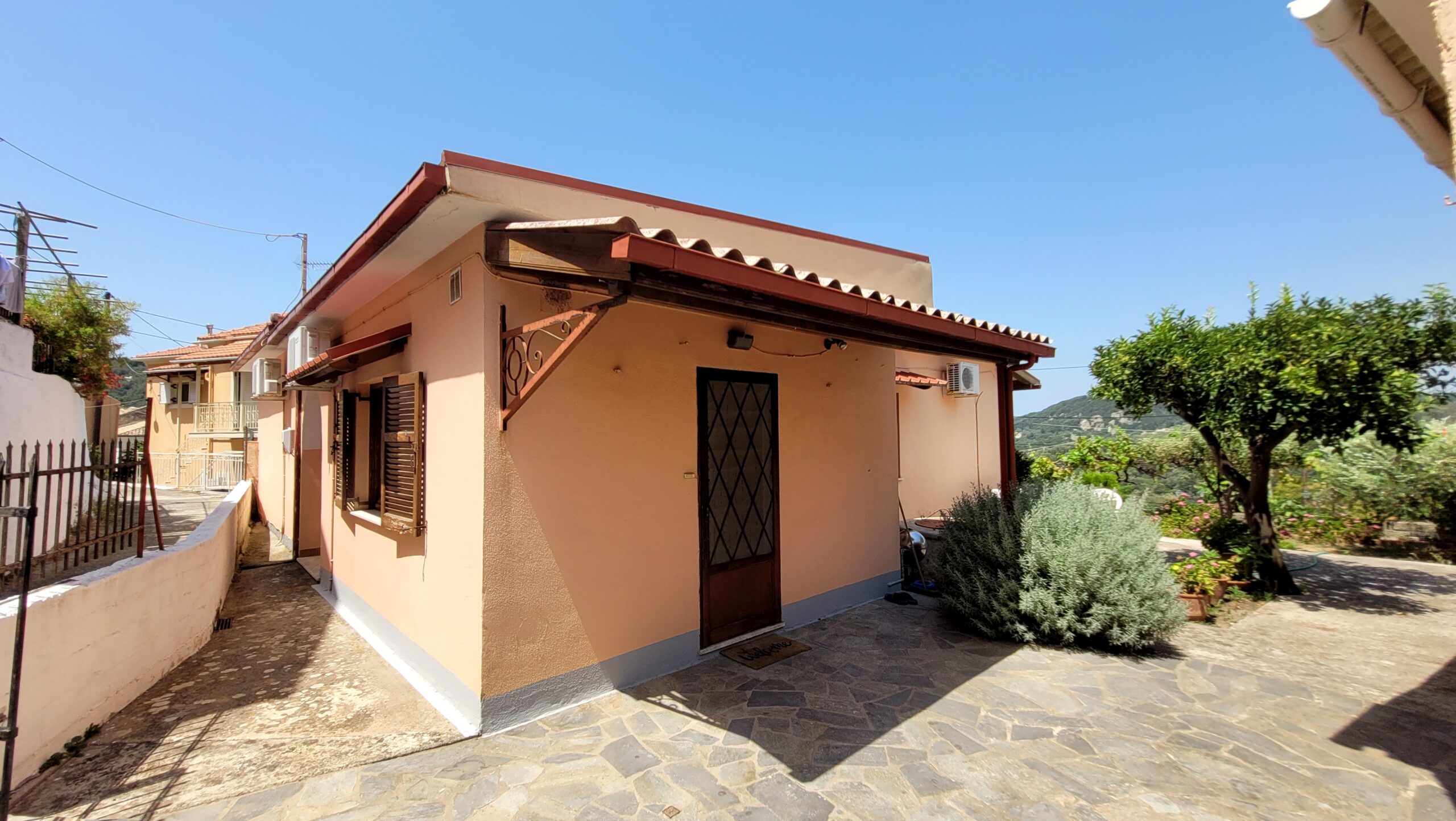 Entrance to detached house with paved outdoor space
