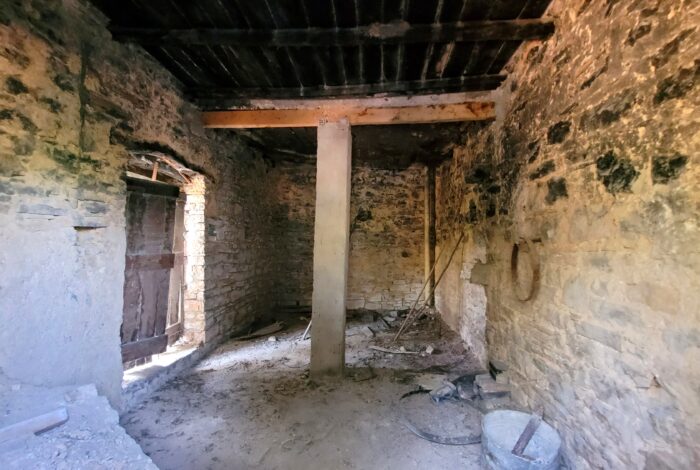 Ground floor interior with original stone walls