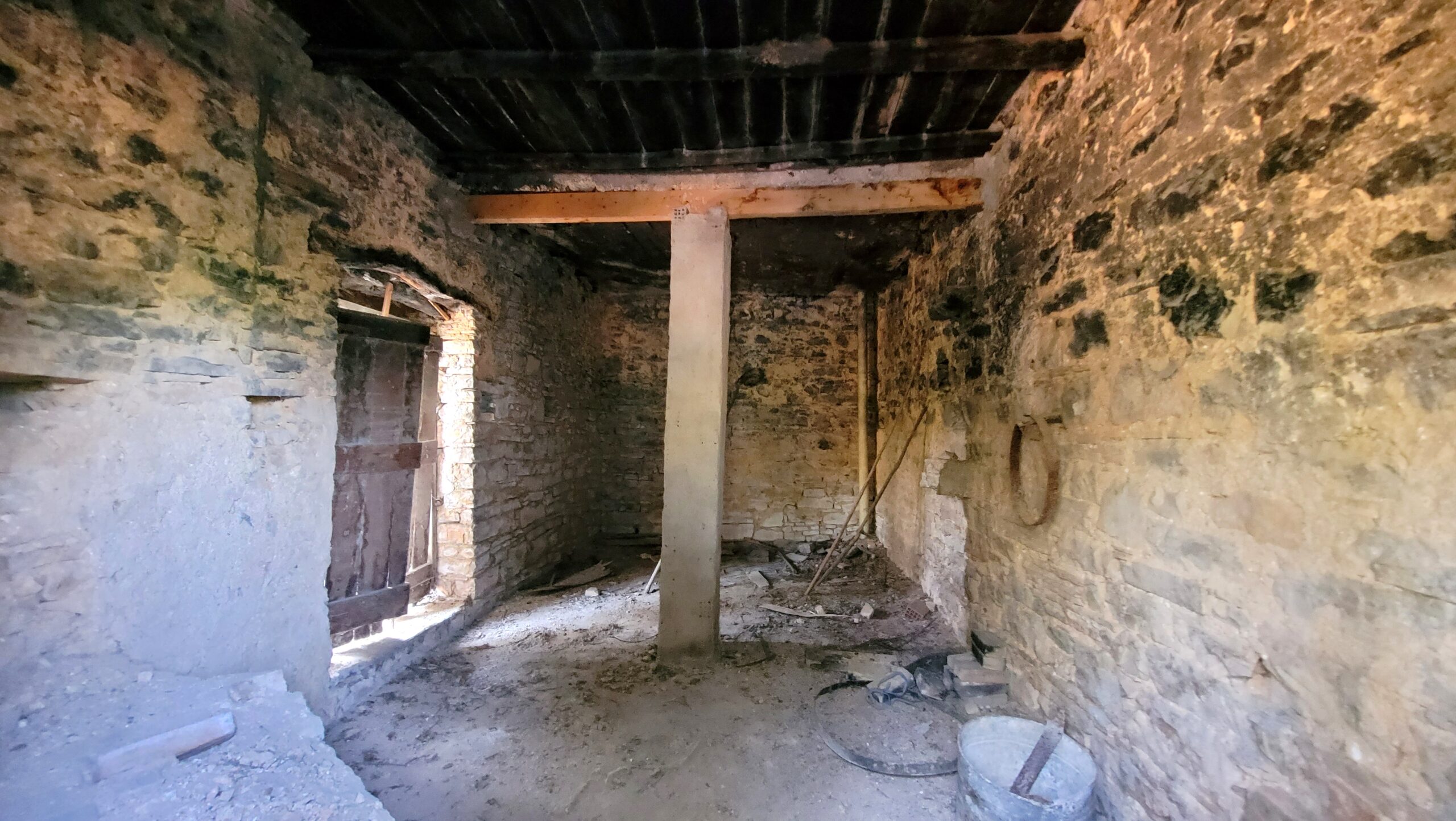 Ground floor interior with original stone walls