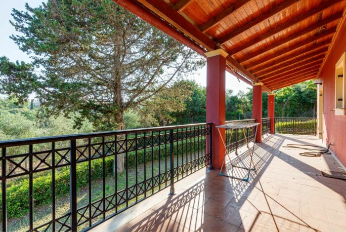 Spacious veranda with countryside views, ideal for outdoor dining and relaxation