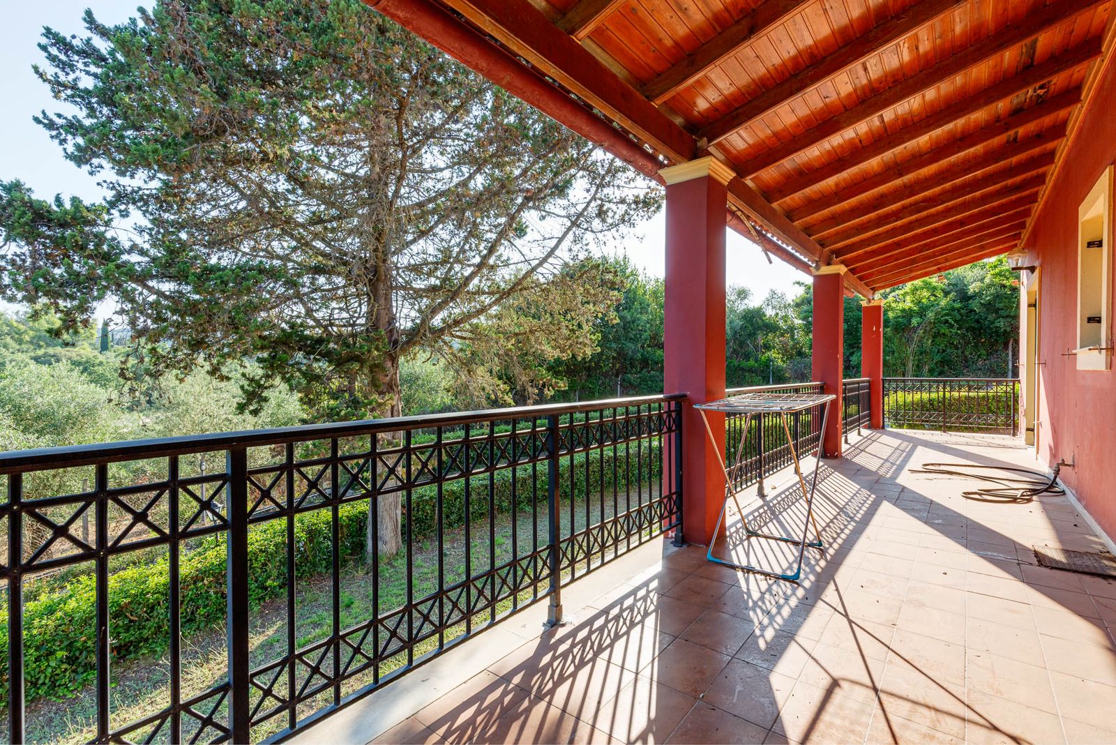 Spacious veranda with countryside views, ideal for outdoor dining and relaxation
