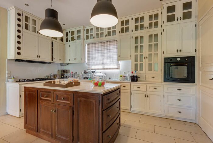Fully equipped kitchen with traditional cabinetry and dining area