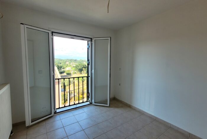 Spacious bedroom with natural light on the first floor