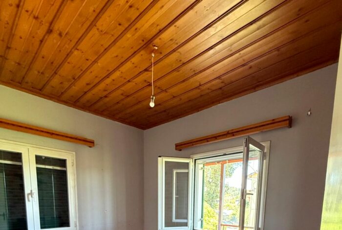 Bedroom with window in Perama detached house