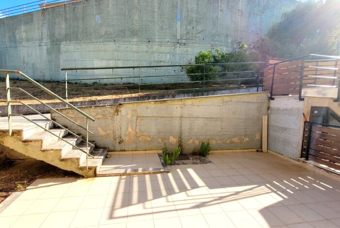 Private paved small yard at the main entrance