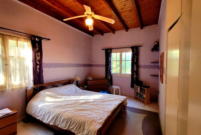 Cozy bedroom with natural light in detached countryside house for sale in Linia South Corfu