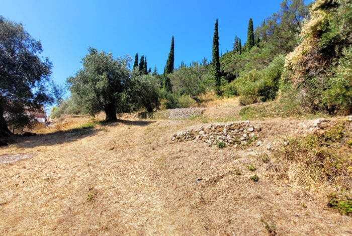 Plot surrounded by lush landscape in Doukades