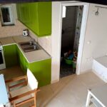 Ground floor area with an open plan kitchen/living room and the bathroom