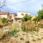 Flat buildable plot next to stone house for sale