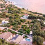 Aerial view of the villa for sale in Paramonas, Corfu with swimming pool and sea views