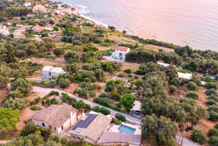 Aerial view of the villa for sale in Paramonas, Corfu with swimming pool and sea views