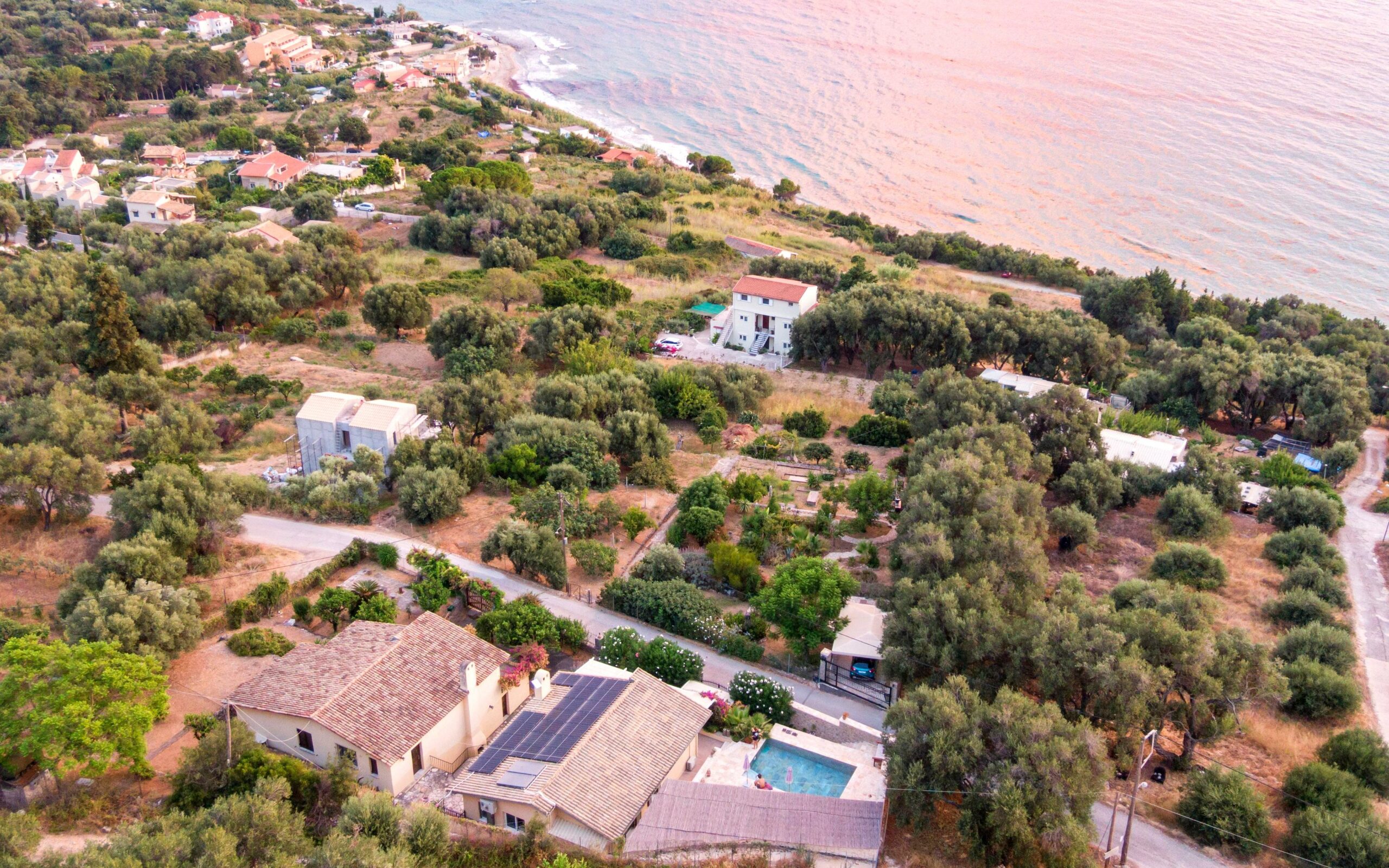 Aerial view of the villa for sale in Paramonas, Corfu with swimming pool and sea views
