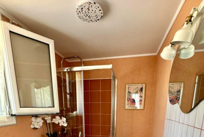 Ensuite bathroom with shower and natural light in Corfu villa