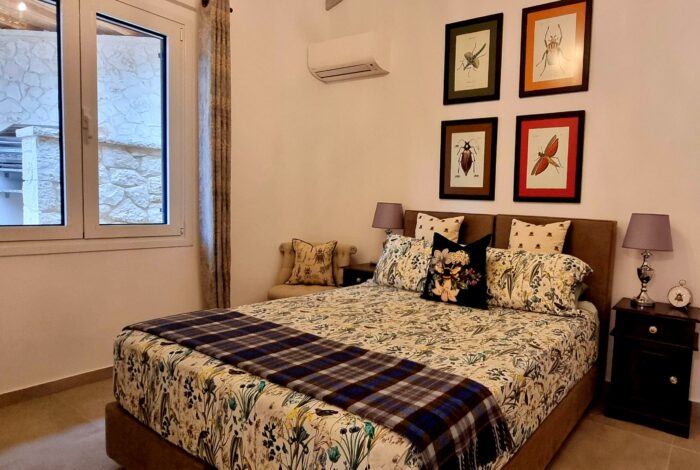 Spacious double bedroom with natural light in Corfu villa
