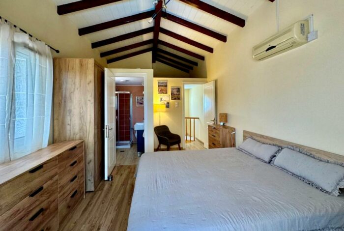Master bedroom with ensuite bathroom and balcony