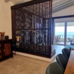 Bright living room with balcony access and sea views in Corfu villa