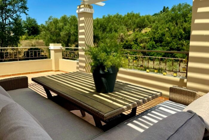 Private balcony off master bedroom with seating area