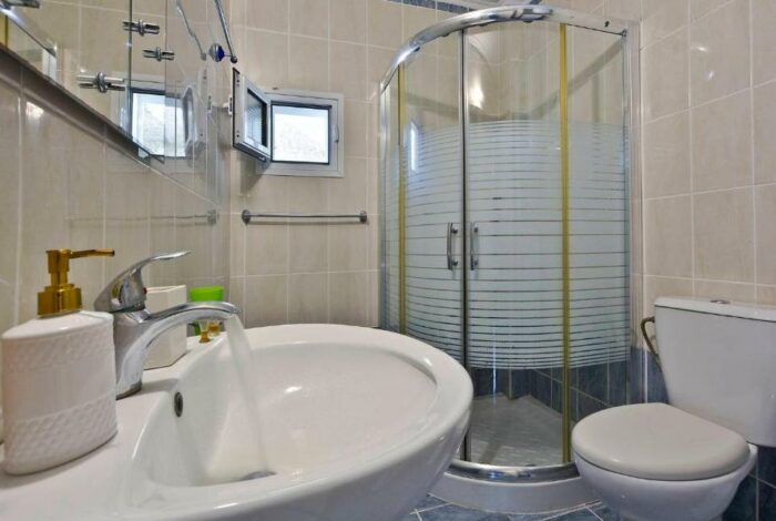 Modern bathroom with shower in Corfu apartment