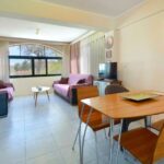 Bright living room with large windows and views, in Gouvia property