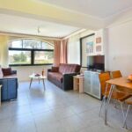 Comfortable living room with natural light Corfu apartment