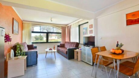 Comfortable living room with natural light Corfu apartment