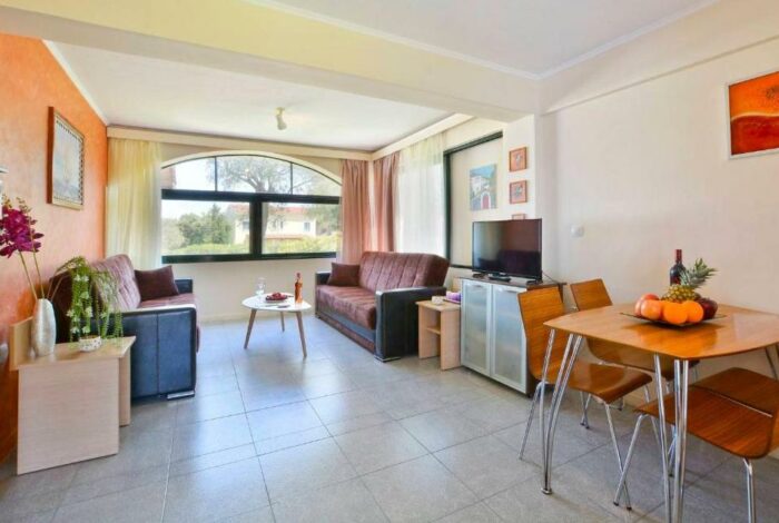 Comfortable living room with natural light Corfu apartment