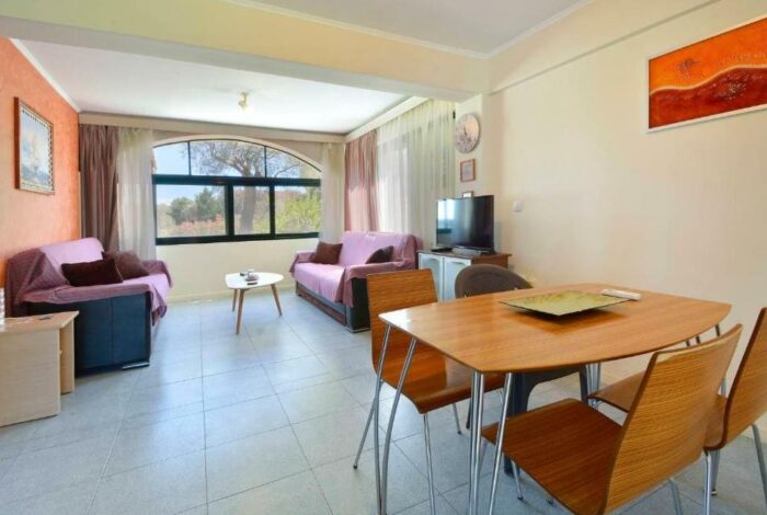 Bright living room with large windows and views, in Gouvia property