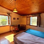 First floor bedroom with views to garden in maisonette South Corfu