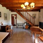 Ground floor living space with fireplace in Corfu maisonette