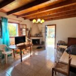 Living room with fireplace in maisonette Agios Georgios South Corfu property for sale