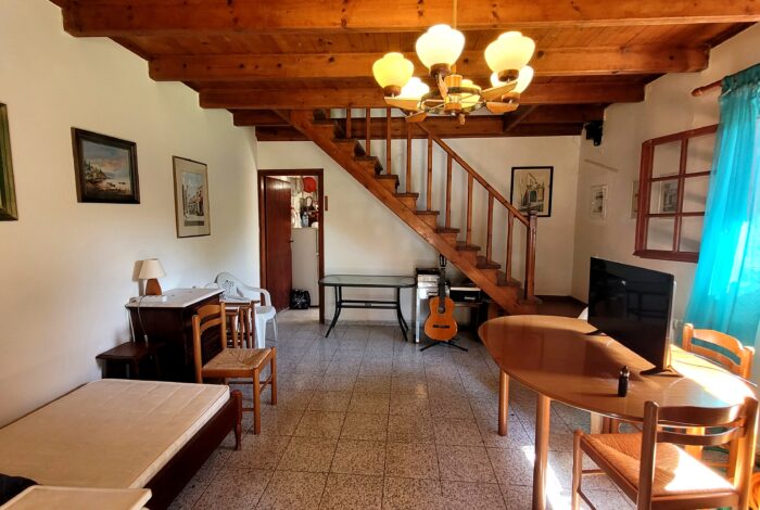 Ground floor living space with fireplace in Corfu maisonette