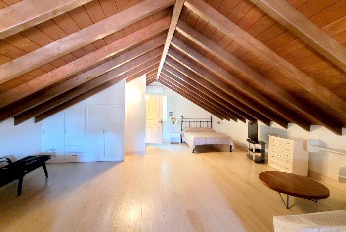 Cozy bedroom with natural light on the first floor of Paxos real estate