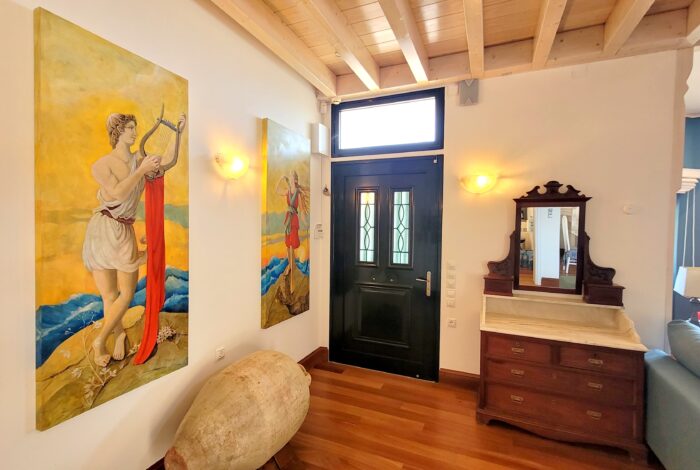 Wooden floors and stone details in renovated Paxos villa interior