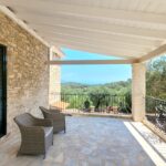 Garden area with terrace for alfresco dining in Paxos villa property