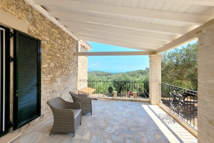 Garden area with terrace for alfresco dining in Paxos villa property
