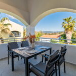 Large private veranda overlooking landscaped gardens in Corfu resort apartment