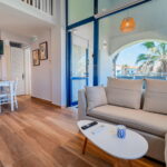 Spacious living room with modern furnishings in Corfu apartment for sale