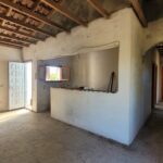 Open-plan living and kitchen area unfinished interior