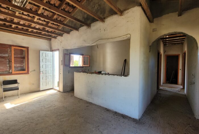 Open-plan living and kitchen area unfinished interior