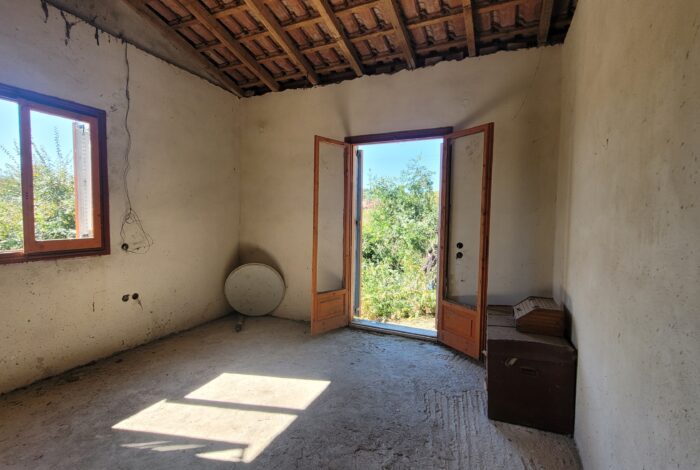 Spacious bedroom with natural light in rural setting