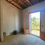 Bright bedroom space with renovation potential in Corfu home