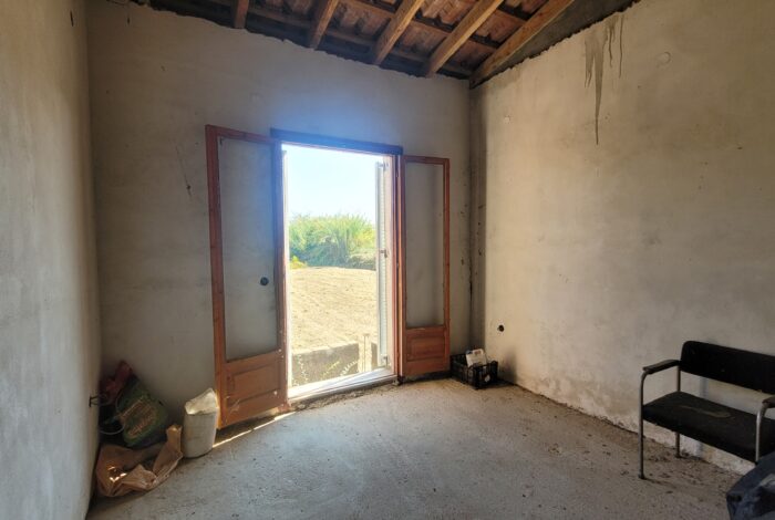 Renovation-ready bedroom in Corfu real estate listing